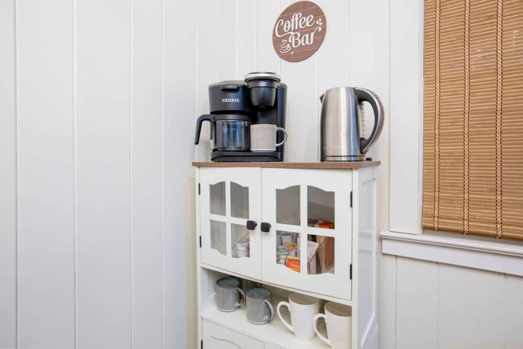 Welcome to the cozy coffee bar—complete with a Keurig, hot water kettle, and plenty of mugs! Enjoy a fresh cup of coffee, or unwind with our variety of soothing teas and rich hot chocolate, perfect for any time of day.
