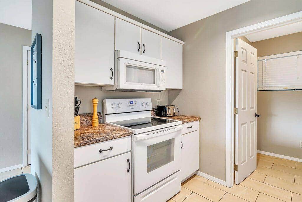 Kitchen with full oven and glass cooktop