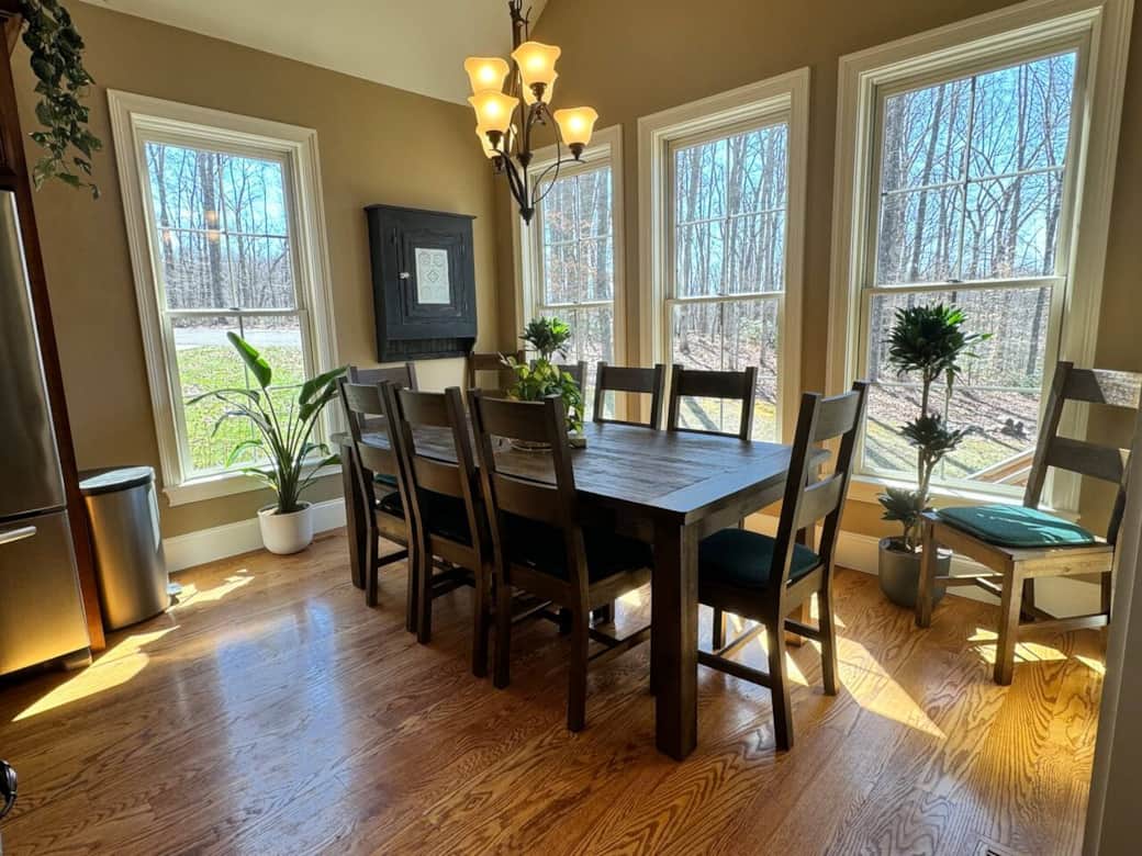 This dining room accommodates 10 people comfortably, with another 4 at the island, plus 12 on the deck!