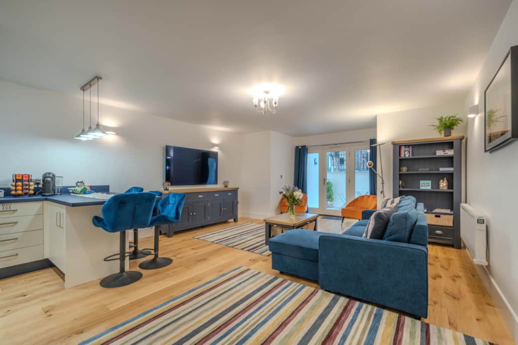 Spacious lounge area with 65" TV
