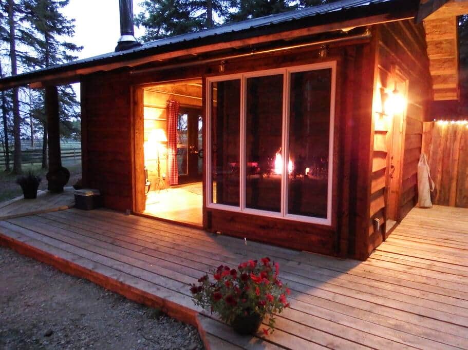 Outside Camp Fire reflecting
       in the sliding glass barn door