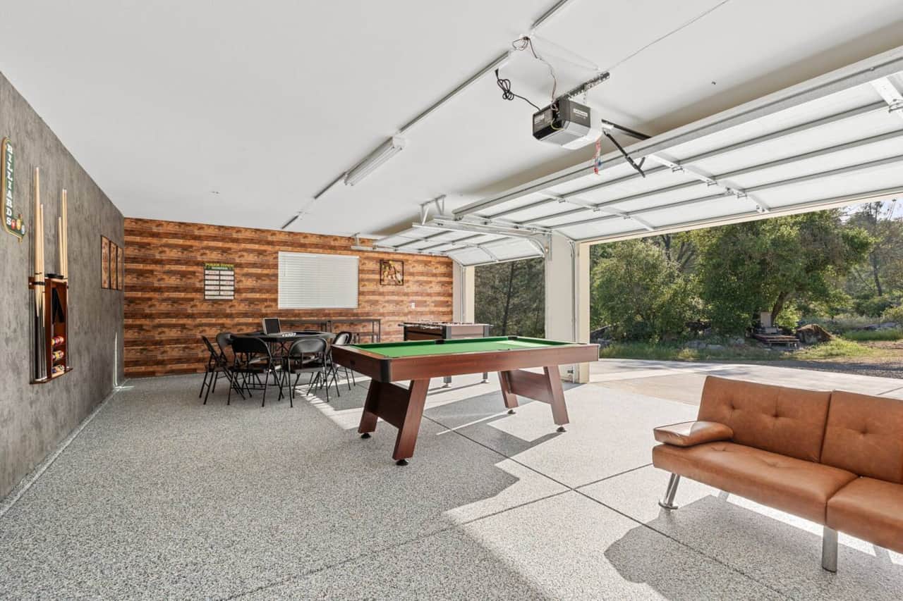 Large spacious game room with a Pool table (4 adult pools sticks & 2 kids pool sticks provided), Poker table w/chips, Foosball table, and a Karaoke system w/2mics!