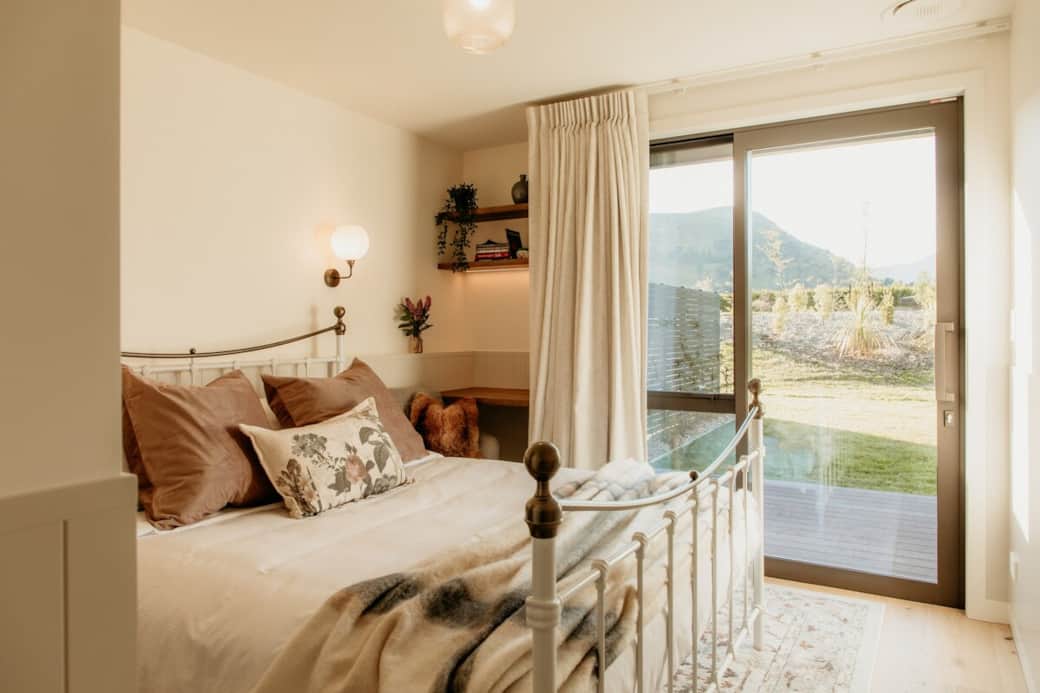 Pull back the blackout curtains to reveal views of Coronet Peak. 