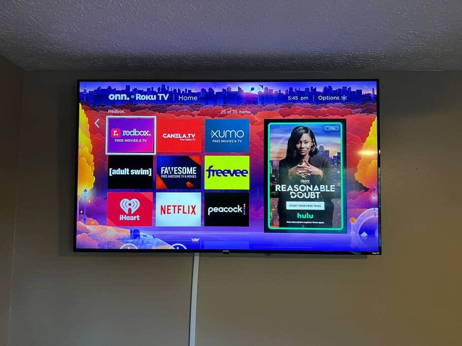 65 inch smart TV in the living room with cable and sports! Sign in to your streaming services too!