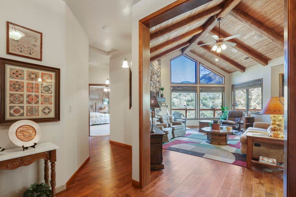 Hallway into Living Room with large Windows
