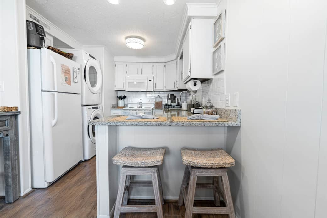 Kitchen equipped with many appliances to enjoy the comforts of home.