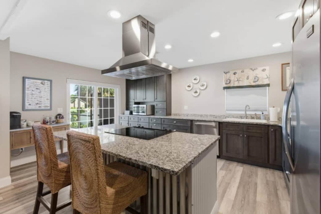 A chef inspired kitchen open to the living room and dining room