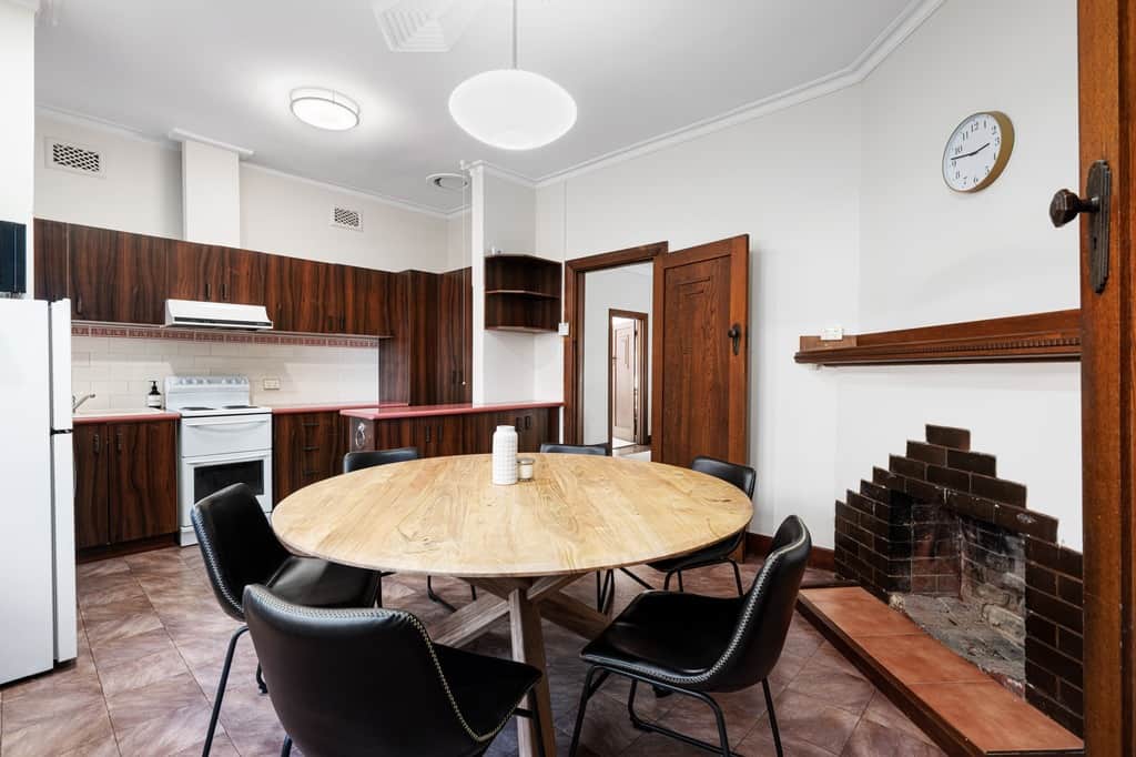 The dining area is adjacent to the kitchen.