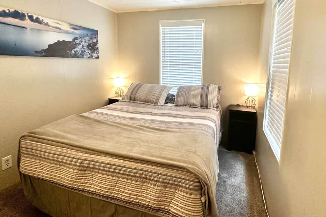 One of the queen beds in the 4 bedroom house