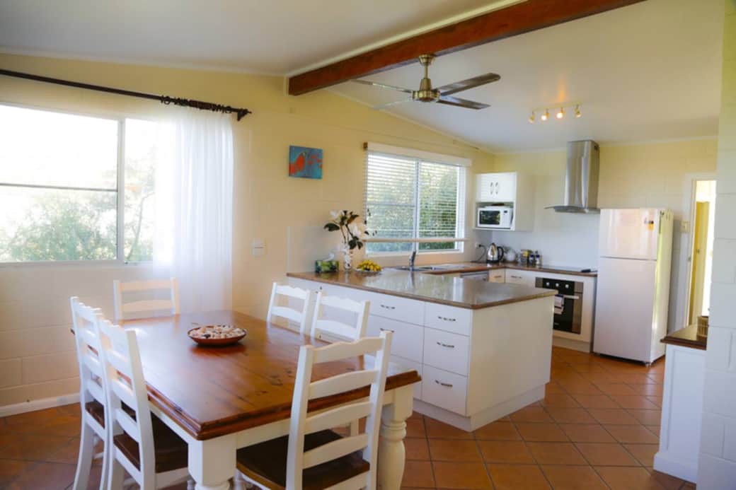 Shalom by the Sea - Dining area through to kitchen and back door. 