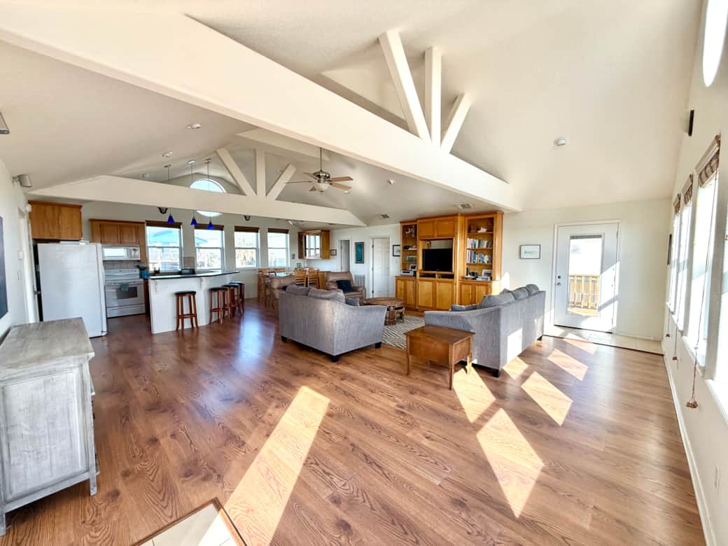 The main living area has comfortable seating for lounging and dining and is open to the kitchen. The main living area has comfortable seating for lounging and dining and is open to the kitchen.