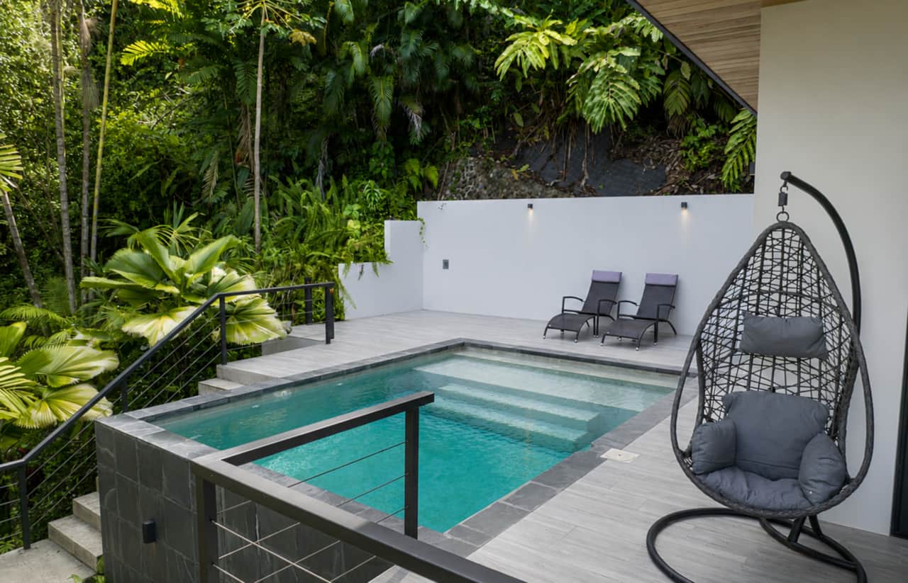 Private pool and lounge terrace surrounded by jungle at Cosara Guest Villa