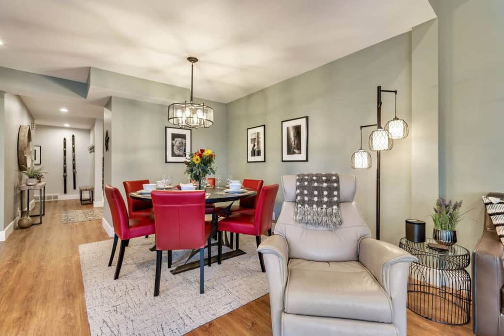 Custom made dining room table, seats six. Four additional seats at breakfast table near window with mountain views.