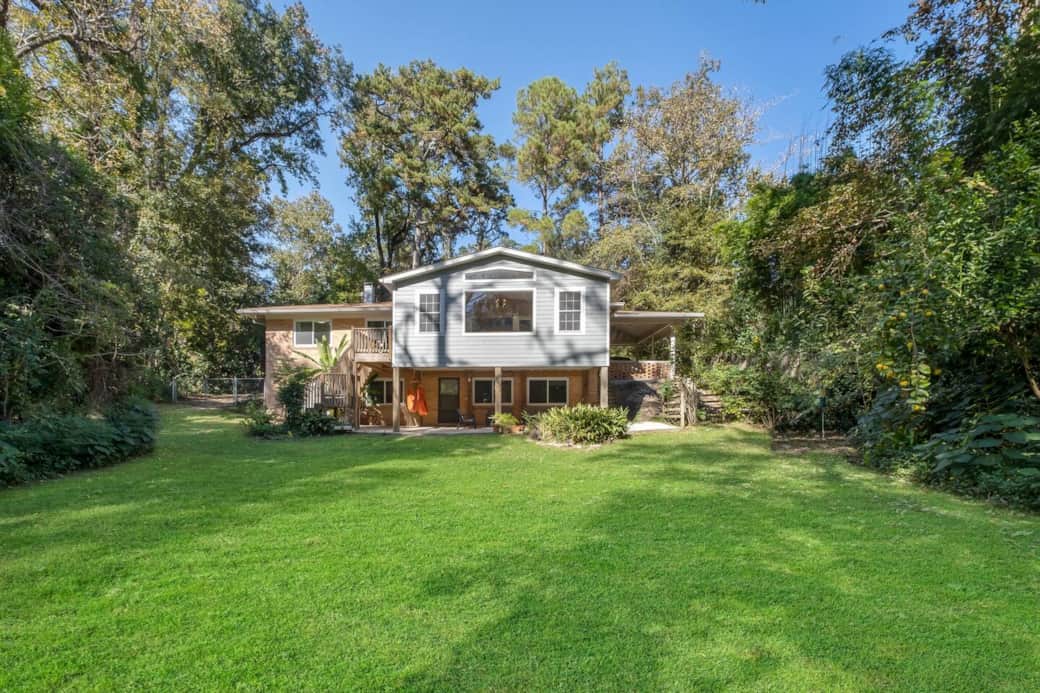 This is the back of the property.  Its lushly landscaped, private. Yard is partially fenced.