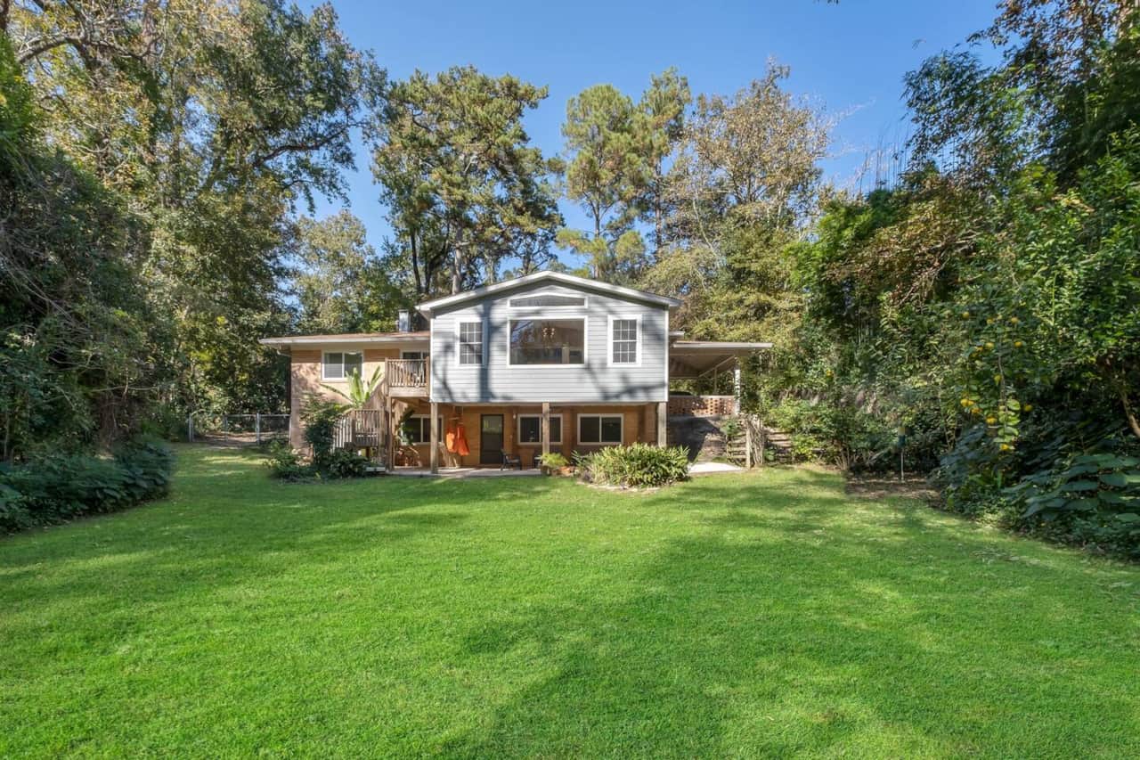 This is the back of the property.  Its lushly landscaped, private. Yard is partially fenced.