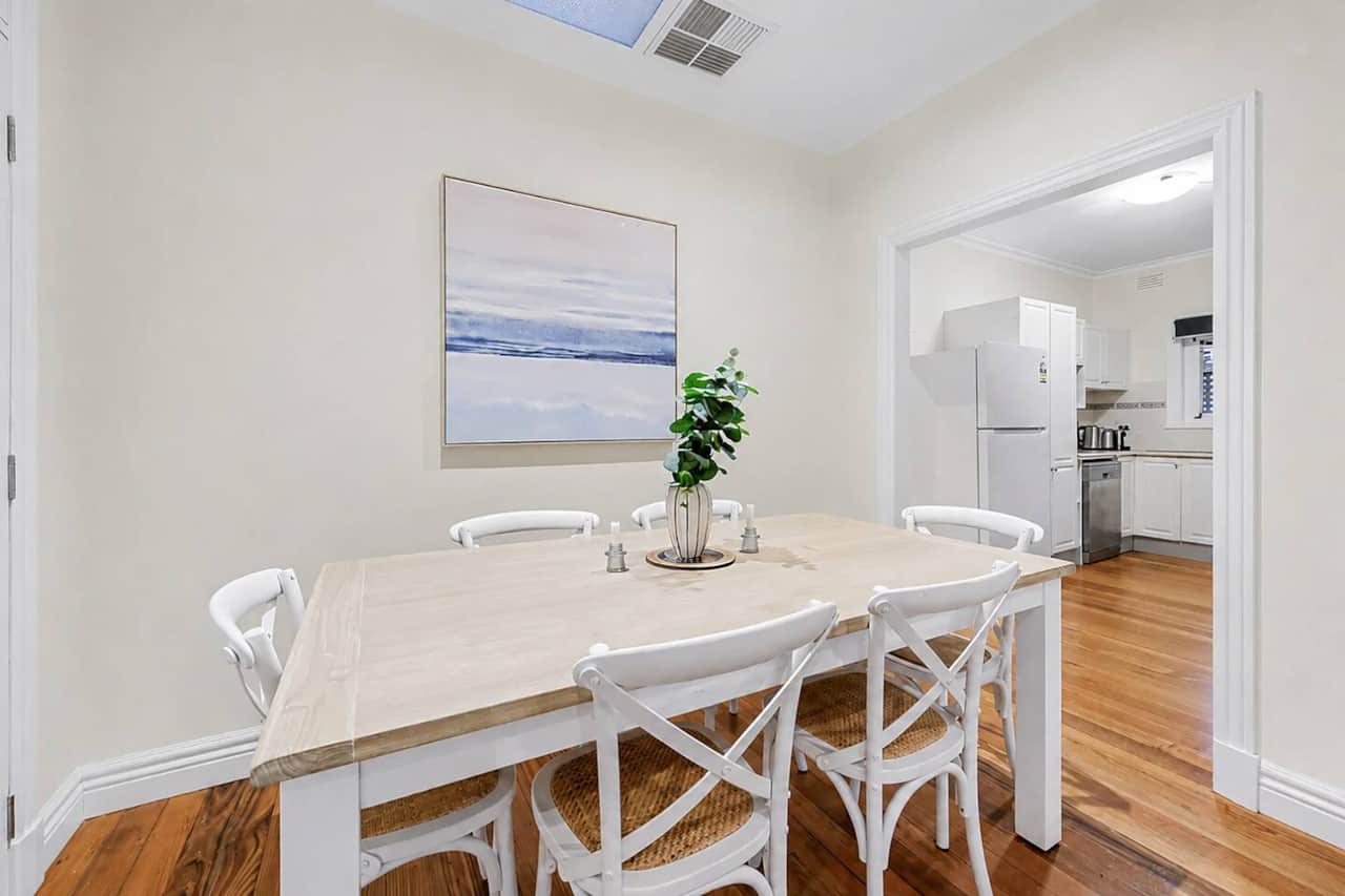 Dedicated dining area beside the kitchen with seating for six—practical for family meals and everyday living during a longer stay.