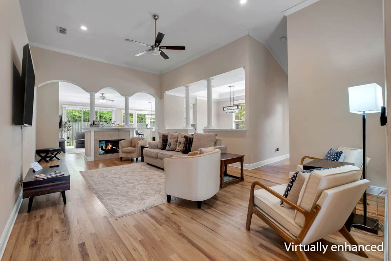 Spacious living room with sitting area. Opens to dining and family (game) room