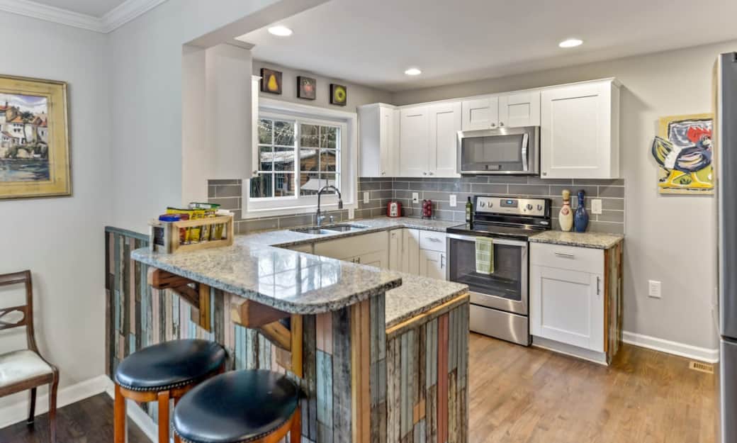 Our gorgeous granite, stainless kitchen is accented with 120 year old beaded board, and brackets made from 120 year old heart of pine floor joists. Our gorgeous granite, stainless kitchen is accented with 120 year old beaded board, and brackets made from 120 year old heart of pine floor joists.
