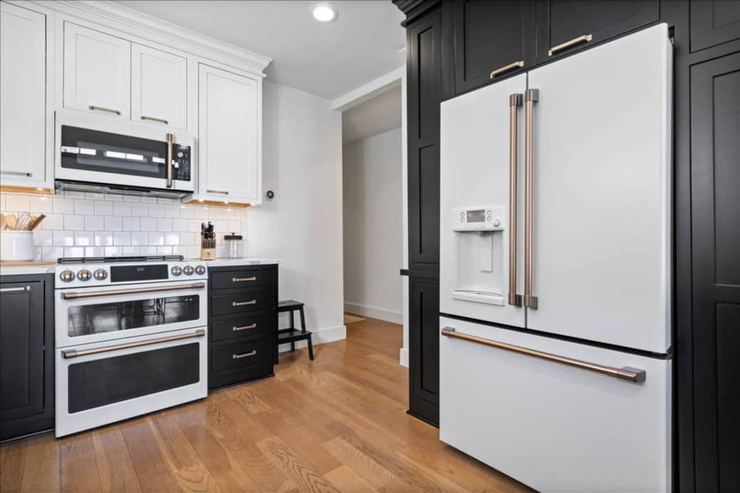 Chef’s kitchen with GE Café appliances and quartz countertops — perfect for cooking or cocktails.