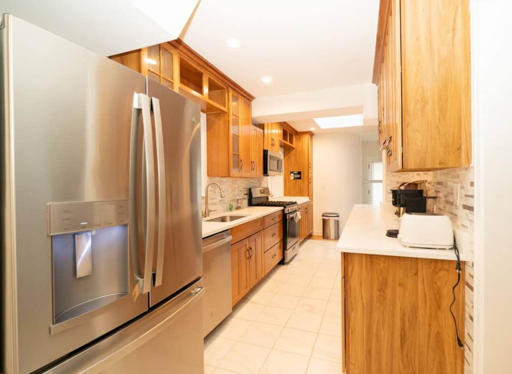 Modern kitchen featuring appliances, cookware, and plenty of counter space