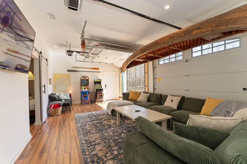 Our uniquely designed game room - 70" smart TV & arcade games - garage doors open to enjoy the fresh Maine air