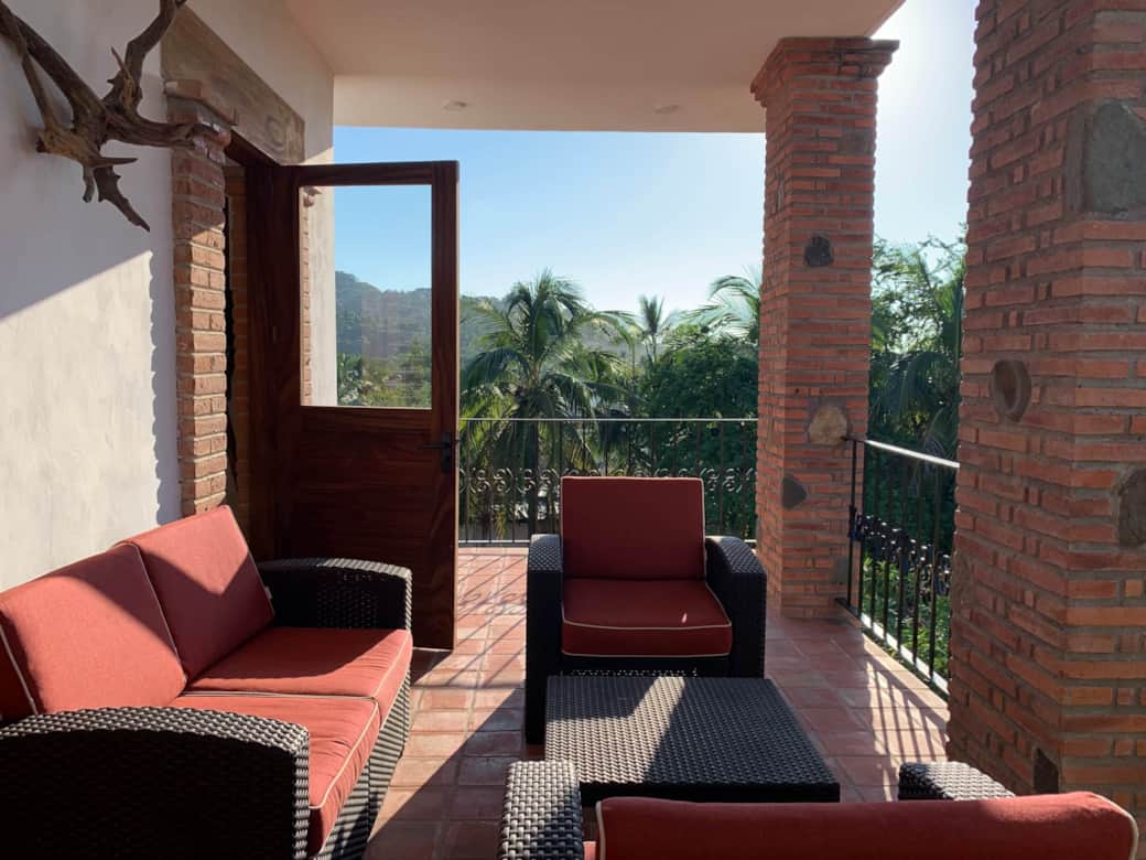 Second floor patio with ceiling fan