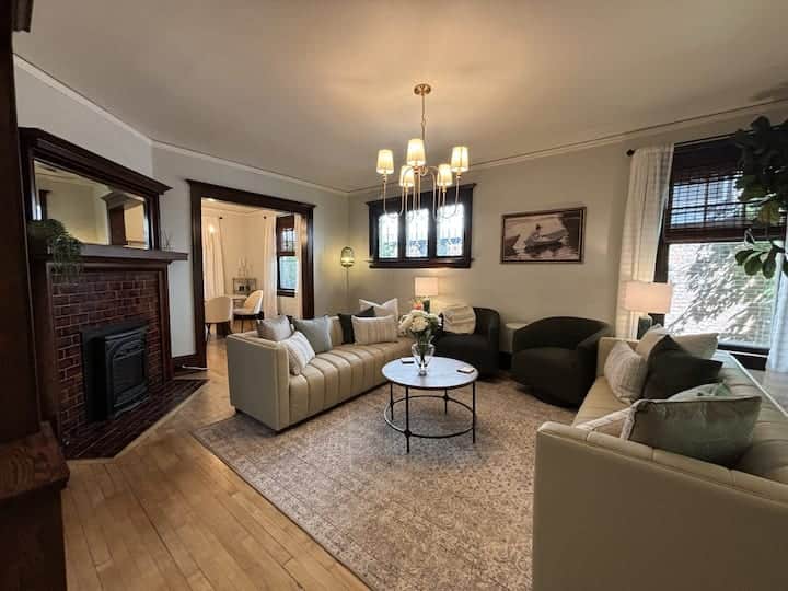 Inviting living room with cozy seating, warm hardwood floors, and charming architectural details.