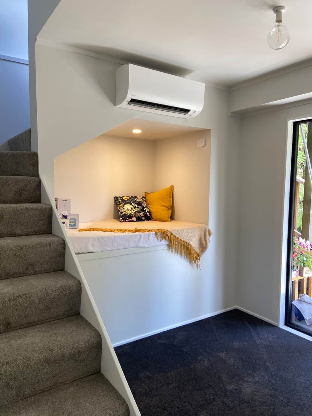 Cosy reading nook under the stairs, kids love it