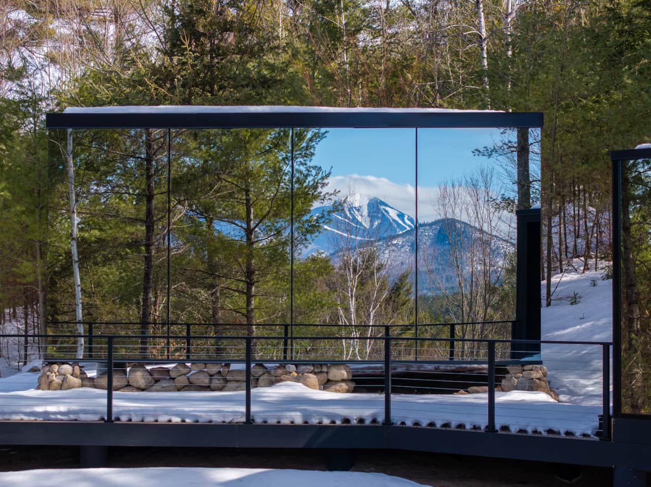 ÖÖD Whiteface at Jay exterior glass reflecting Whiteface Mountain ski trails