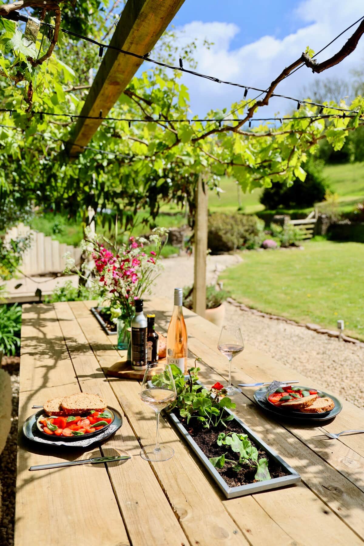 Beautiful outdoor dining area with views of the gardens