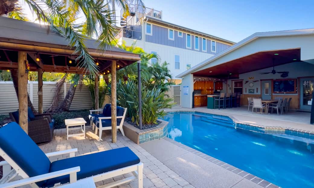 Private tropical pool and covered tiki bar