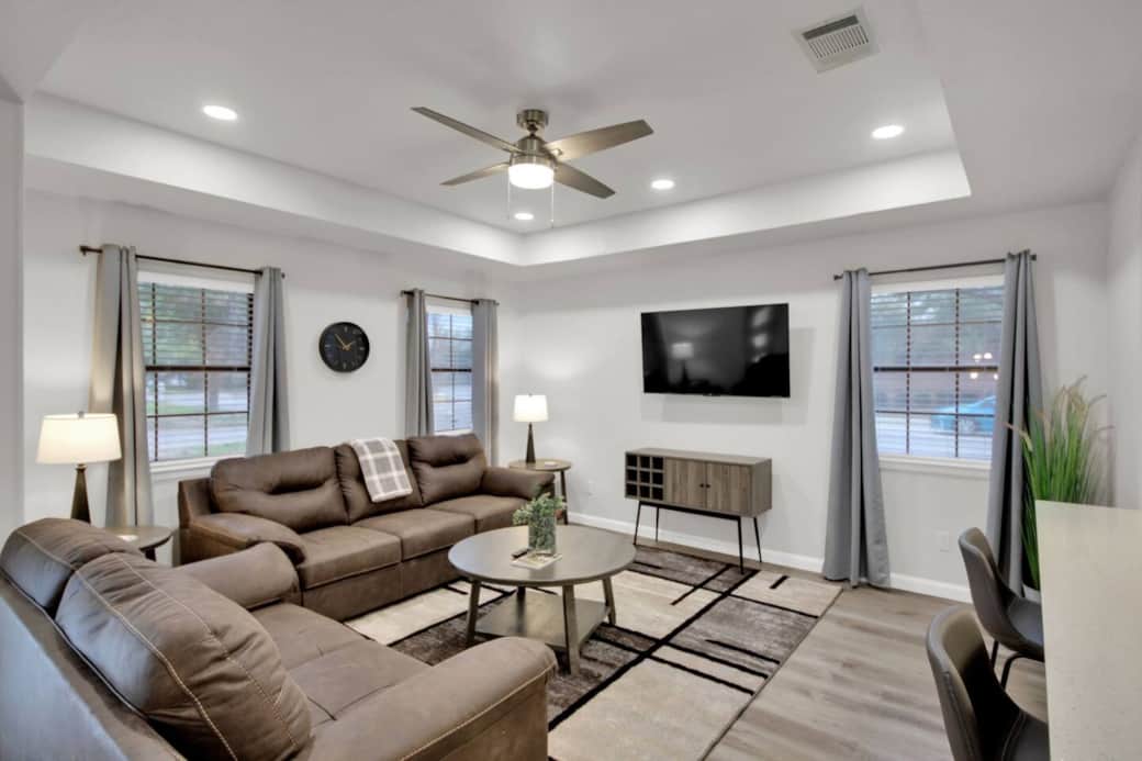 Get comfy in the large, bright living room with its 55" Roku TV and a premium leather sofa and loves Get comfy in the large, bright living room with its 55" Roku TV and a premium leather sofa and loves