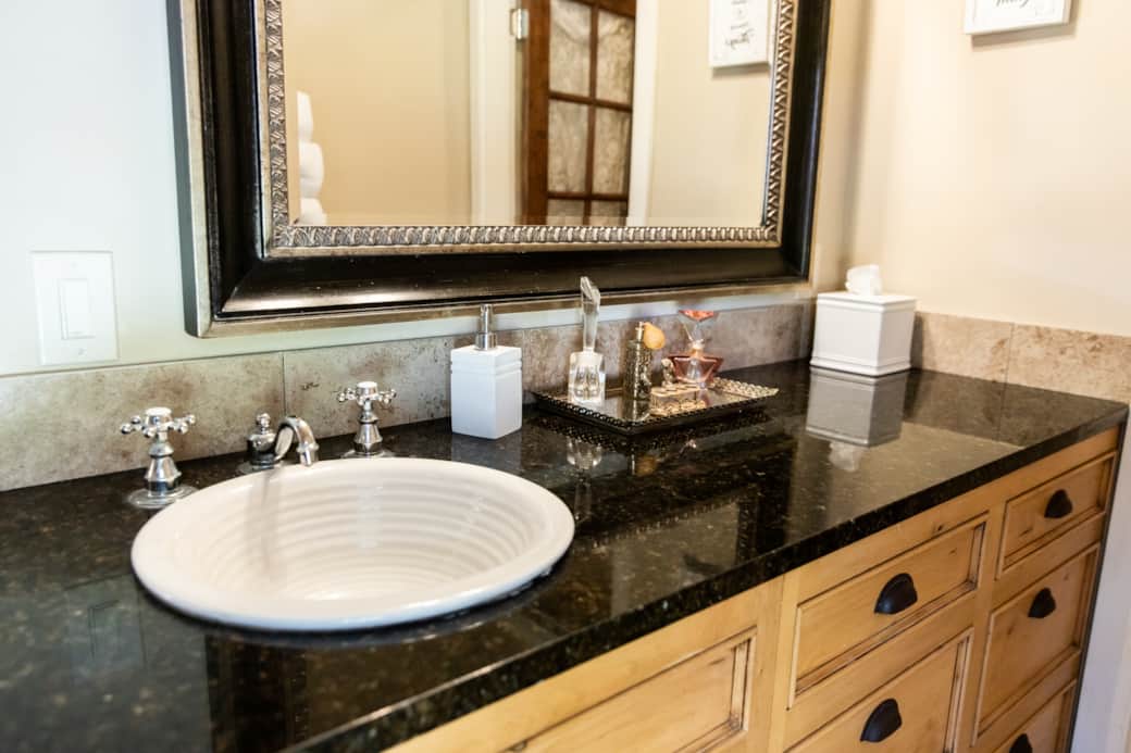 Elegant bathroom vanity with classic fixtures and thoughtful amenities