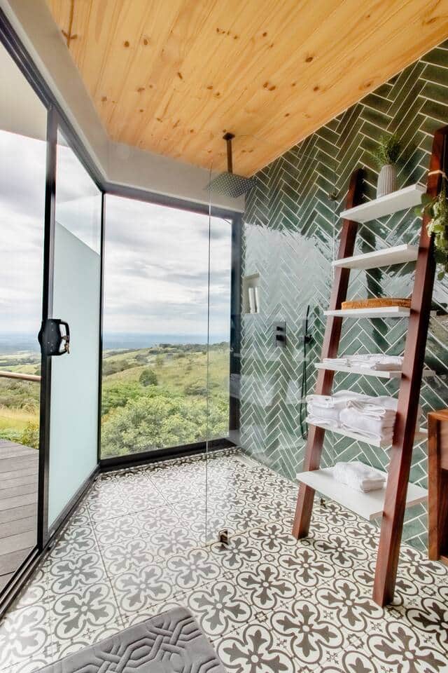 Scenic Shower: Enjoy a refreshing shower with breathtaking views of the valley through the floor-to-ceiling windows.
