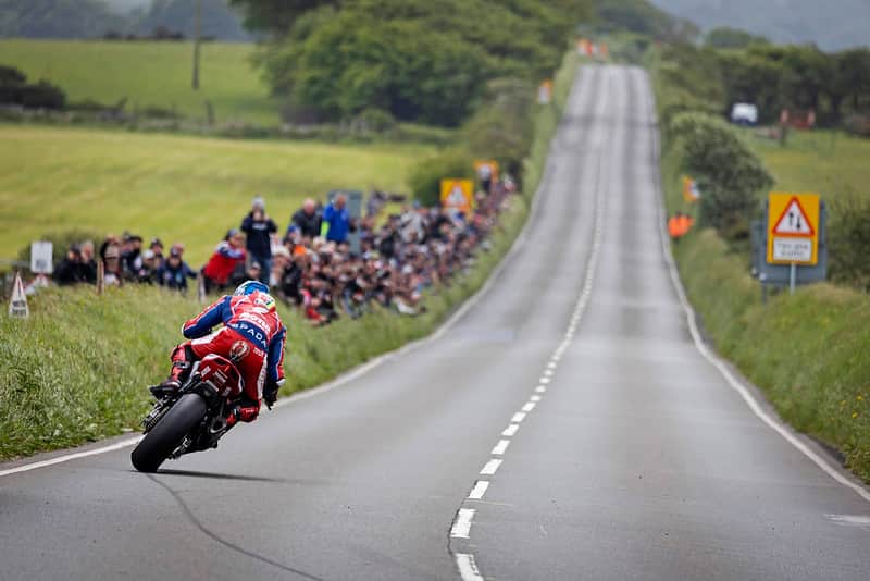 Rider cornering at Creg-ny-Baa during the Isle of Man TT (Credit Visit Isle of Man)