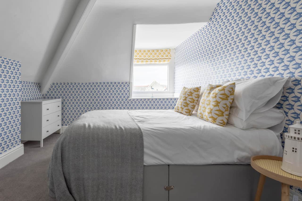 Snug double bedroom featuring a Scion seabird theme.