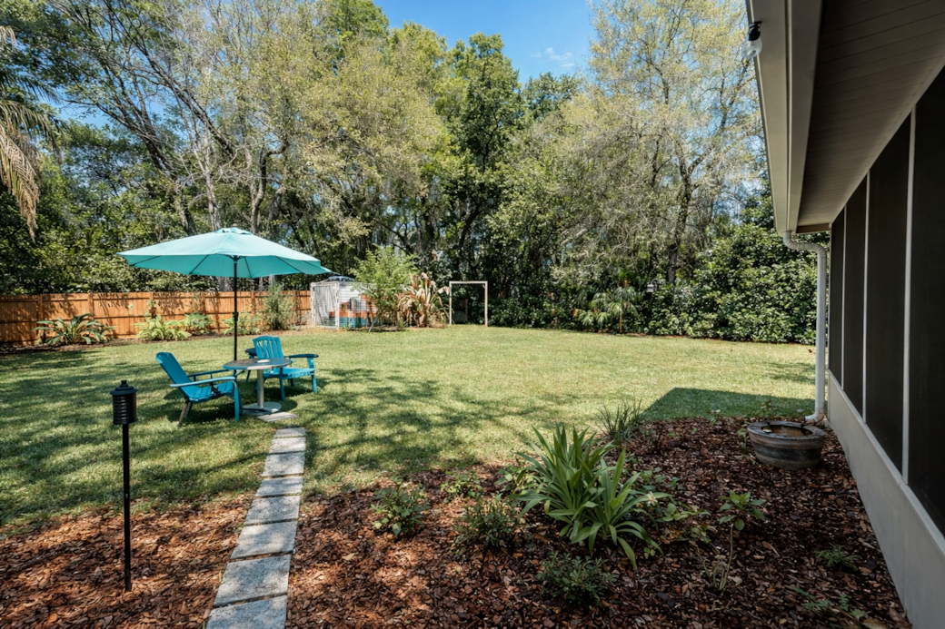 Spacious fenced backyard perfect for relaxing, letting pets roam,