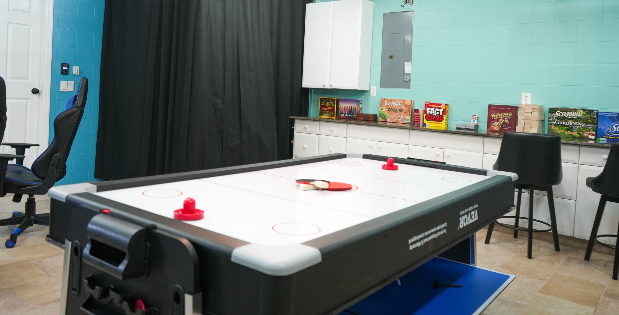Challenge your friends to a game of air hockey in this vibrant game room.