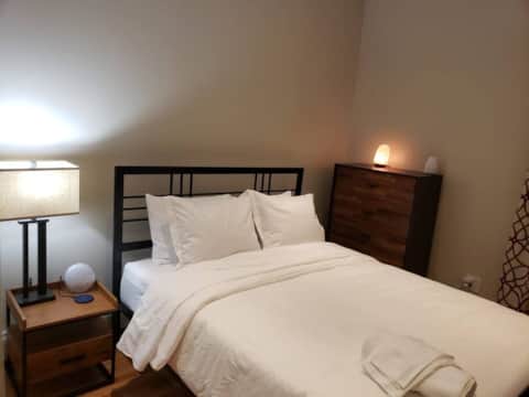 The Junction bathroom — hotel-style finishes in a furnished Brooklyn apartment near Broadway Junction