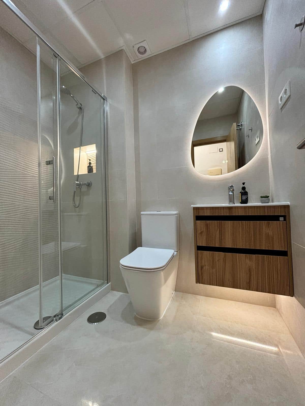 Elegant bathroom with ambient lighting and modern finishes