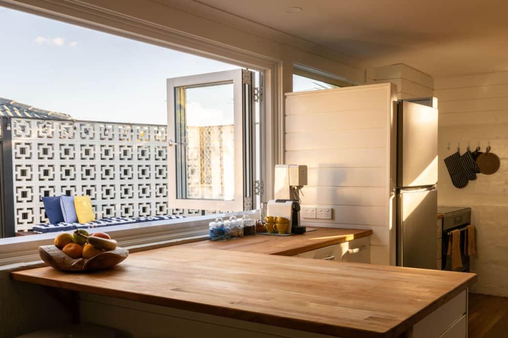 The kitchen serving window is the perfect spot to pass out the morning coffees