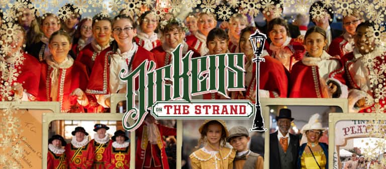 Victorian-costumed performers walking down a festive street at Dickens on the Strand in Galveston