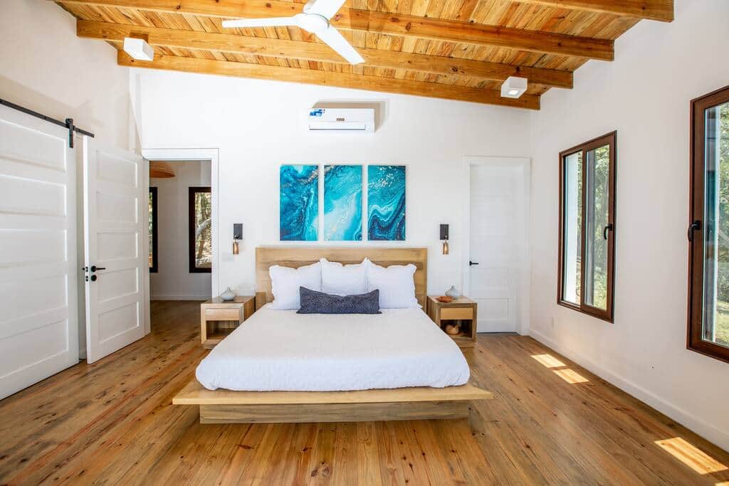 Upper level 1st suite with king size bed and USB plugs on either side of the bed