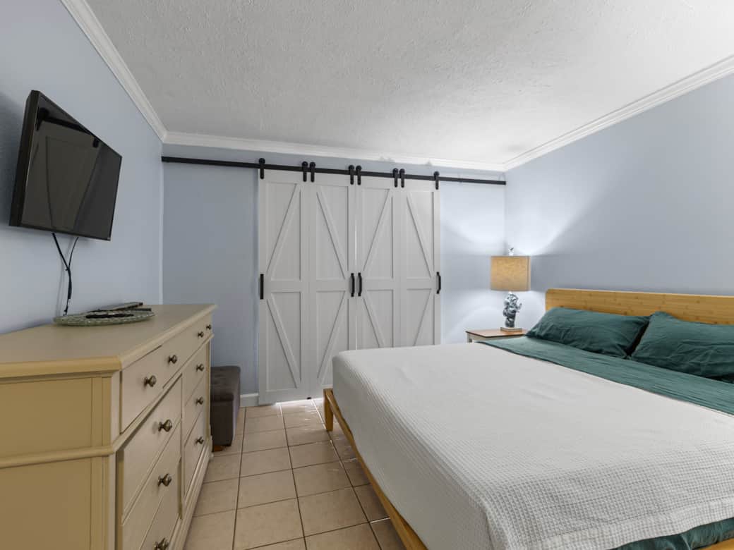 Primary bedroom with barn doors