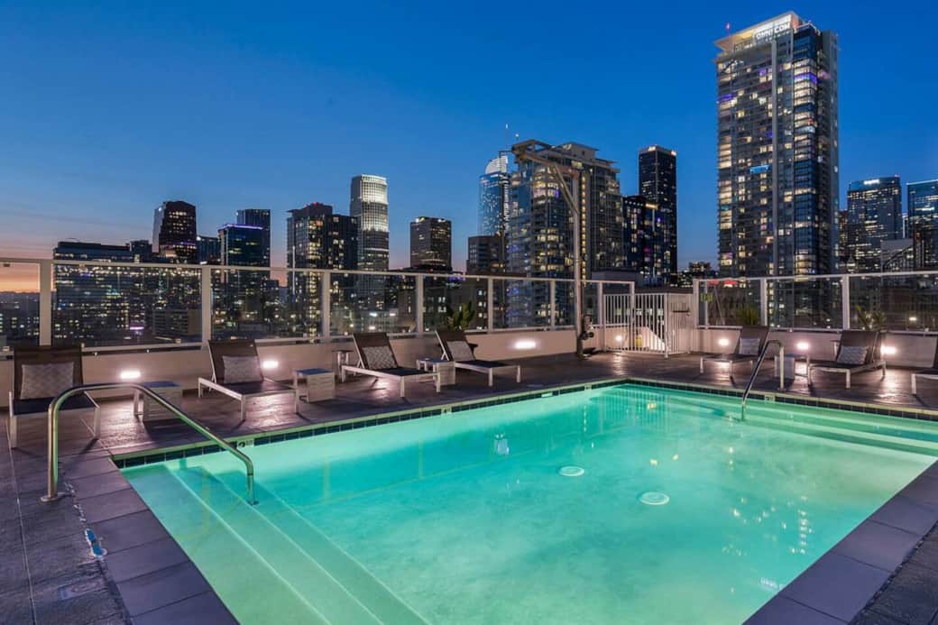 Rooftop pool with panoramic skyline views, perfect for relaxing and unwinding.