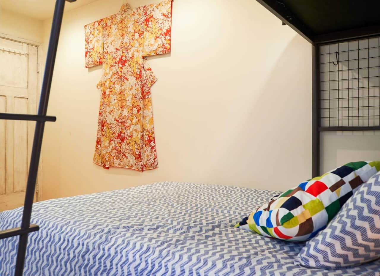 Sleep in style beneath a vibrant display of traditional Japanese kimono