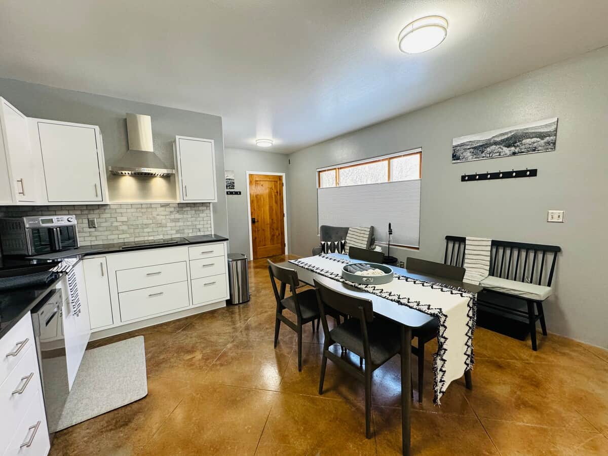 Kitchen with refrigerator, dishwasher, sink, large air fryer, stove top and all kitchen amenities 
