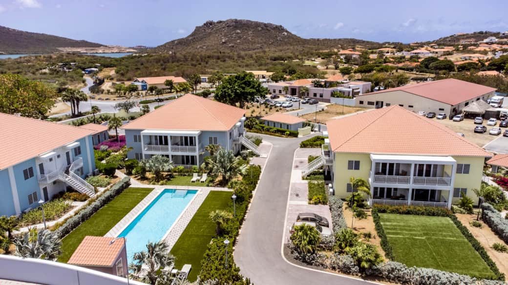 Drone view of the Blije Rust 2 resort and Blue Bay in the background.