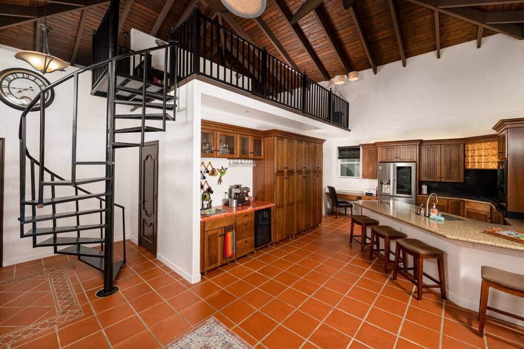 Main indoor living space with kitchen, desk for working, coffee bar, and pantry Main indoor living space with kitchen, desk for working, coffee bar, and pantry
