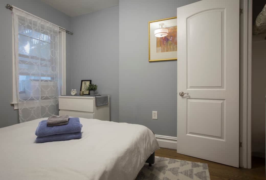 Main bedroom has a dresser and full closet